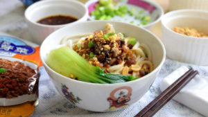 Dan dan noodles (担担面) is the Sichuan street food famous due to its mouth-numbing and spiciness taste. Try this dan dan noodles recipe Sichuan style. It gives you a detail explanation of each step and a video demonstration.