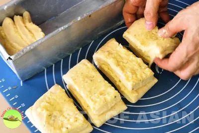 Pull apart garlic bread - arrange dough into bread pan